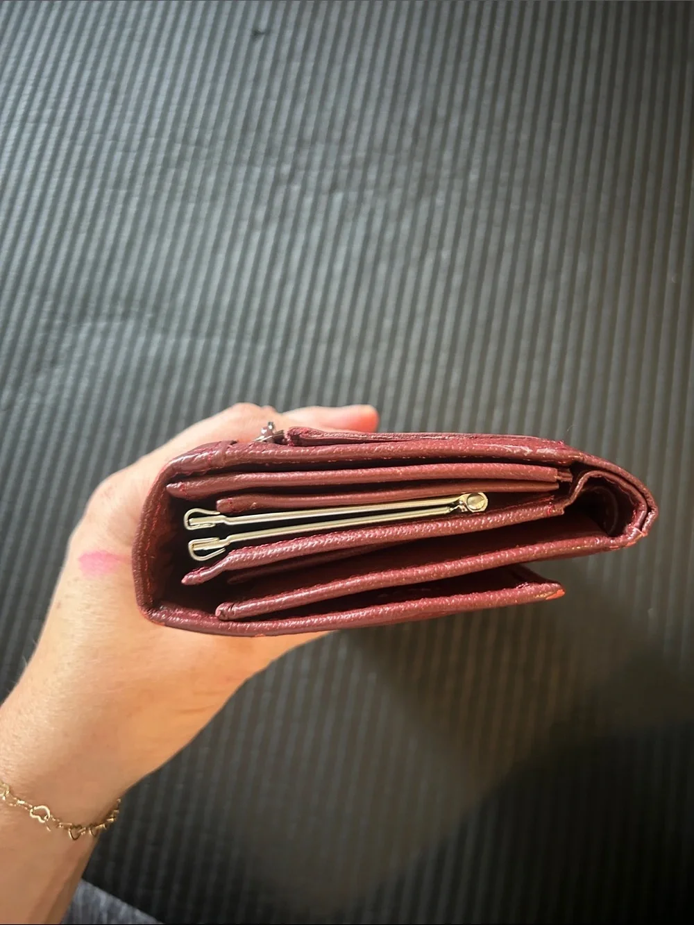 Wilson’s leather, maroon Leather trifold, wallet with Gold Accent